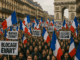 Crowd protesting with French flags.